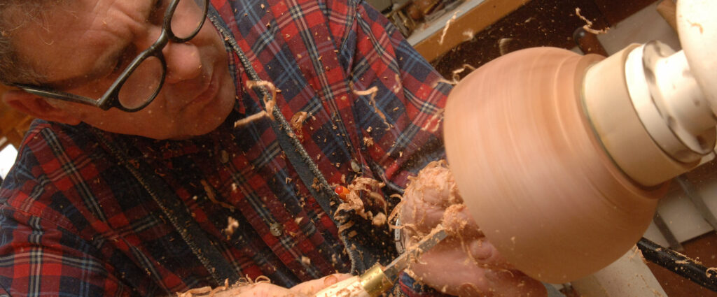 Lee Schuette using a lathe