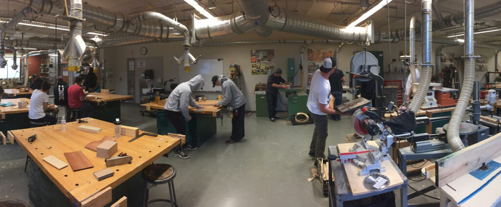 Students working in a machine shop.