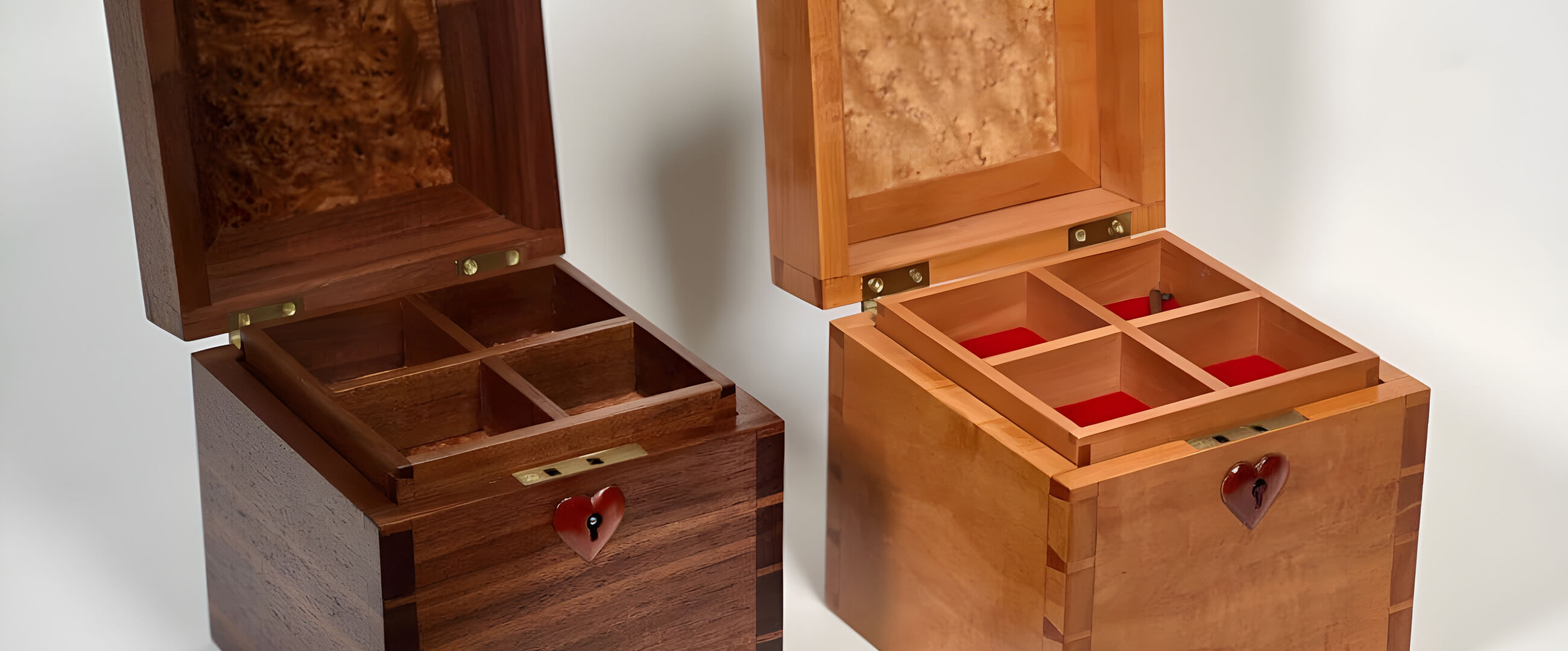 Two wooden stash boxes with hearts on the front.